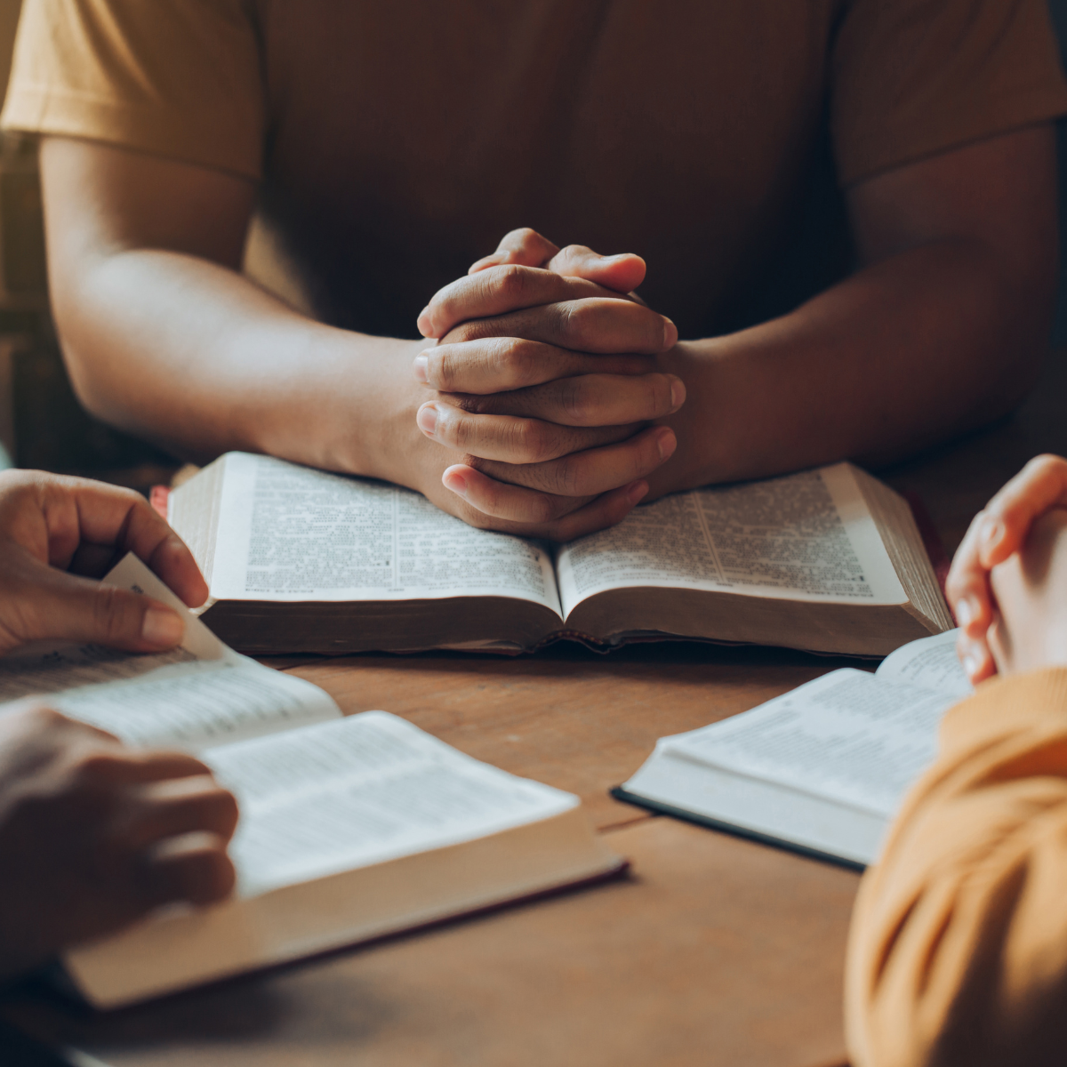 Open Bible with cross symbolizing the foundation of Christian faith and belief in Jesus Christ